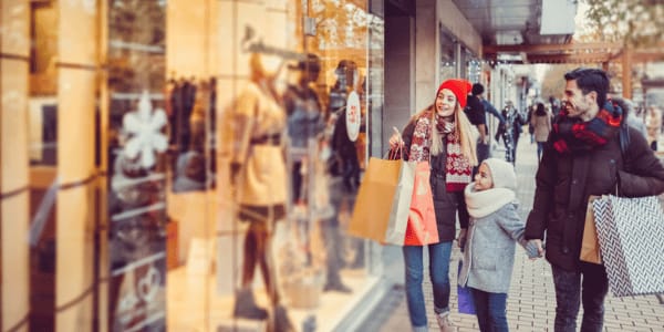 Young family shopping for Christmas stock photo