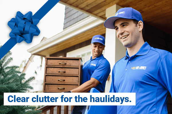 1-800-GOT-JUNK? Employee taking out holiday trash