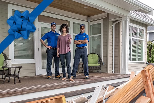 1-800-GOT-JUNK? assisting customer on front porch