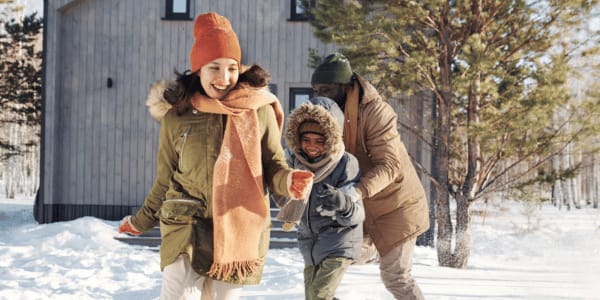family doing winter activities outside