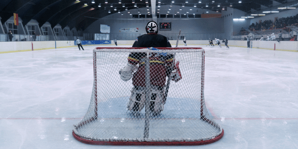 goalie in ice hockey rink in arena 