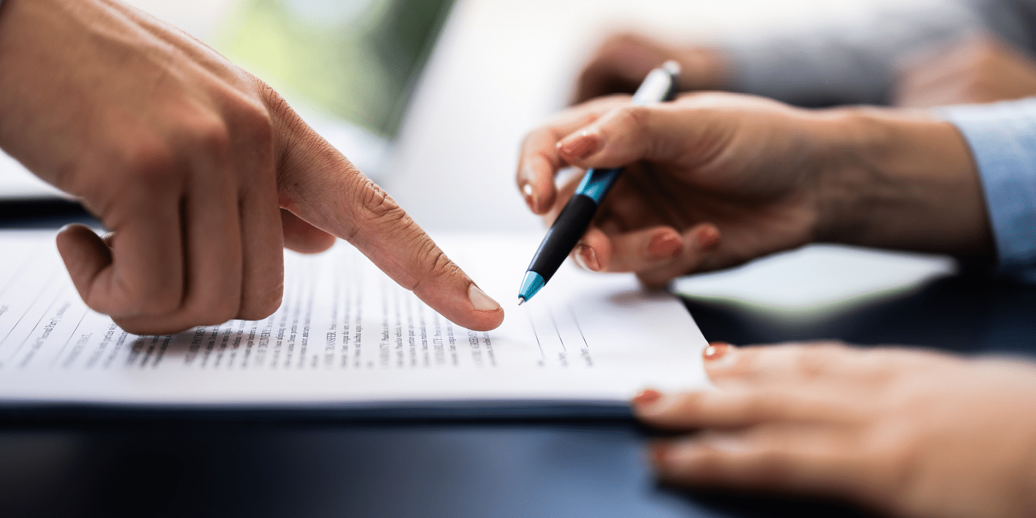 Finger pointing to a paper form