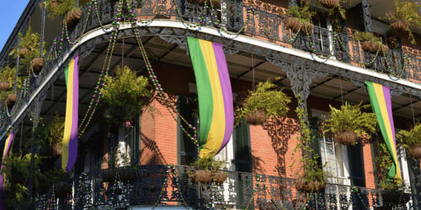 mardi gras decorations on balconies in new Orleans 