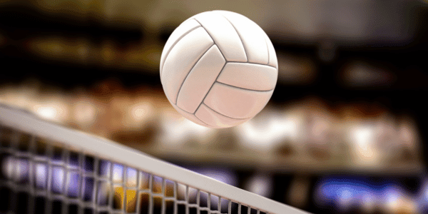 volleyball ball going over net in volleyball game