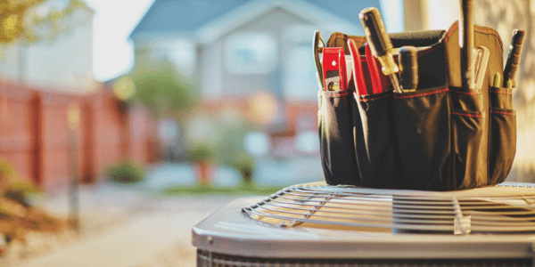 Air conditioner with maintenance tools in residential back yard