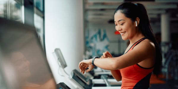 happy woman on treadmill following gym rules