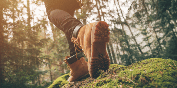 hiking boots of person experiencing the health benefits of hiking