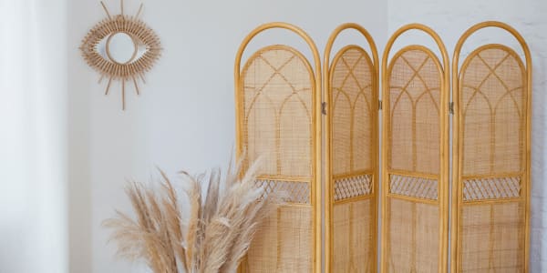 rattan room divider in apartment layout