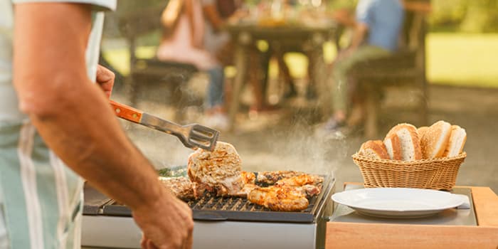 Meat being grilled for a group