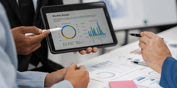Monthly budget presented on tablet in meeting 