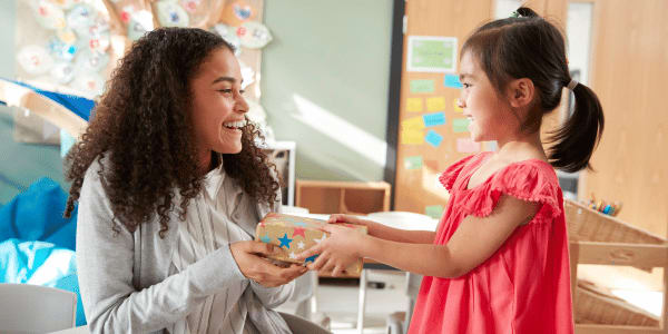 teacher receiving thoughtful teacher gift from student