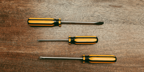 screwdrivers laying on table