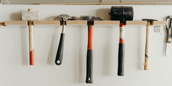 hammers hanging on shelf