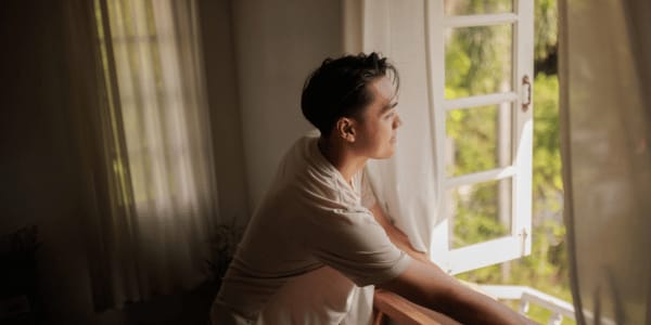 person opening windows to make house smell good