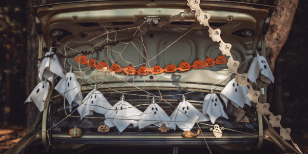 car with spooky trunk or treat decorations