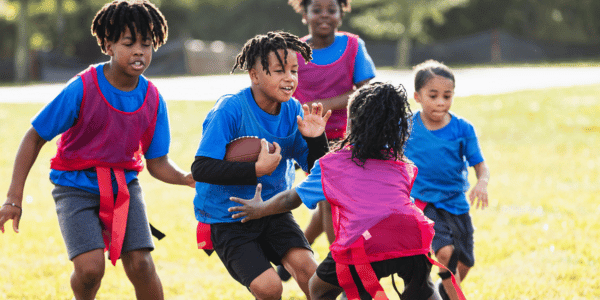 group of children playing flag football
