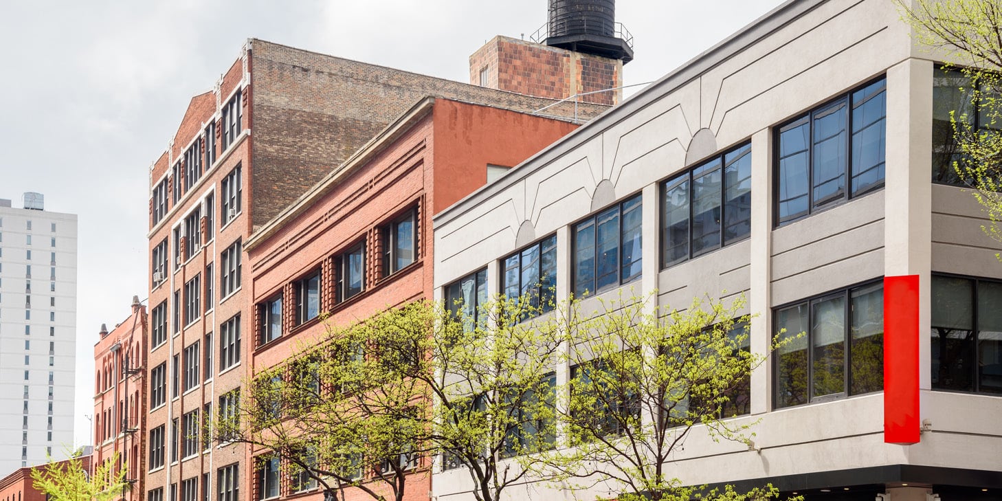 Multi-floor planned unit development with retail and office spaces alongside condominium units