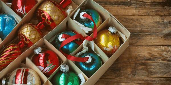 Christmas ornaments organized in cardboard ornament storage box