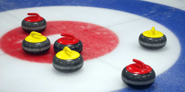 curling stones on the ice