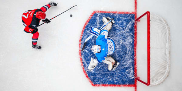 two players playing ice hockey