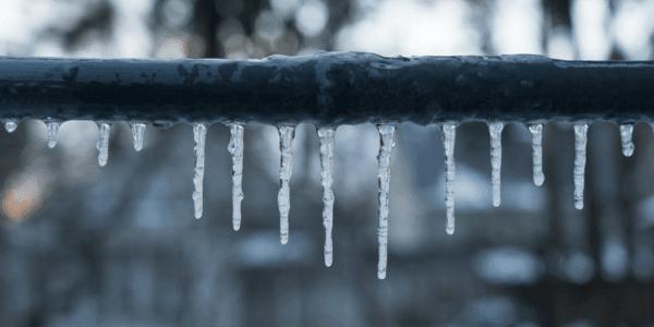 icicles hanging from frozen pipe