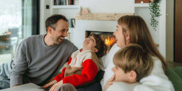 family of four keeping warm in home