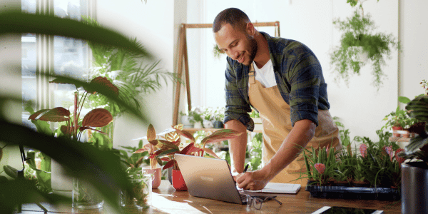 African American man standing in flower shop