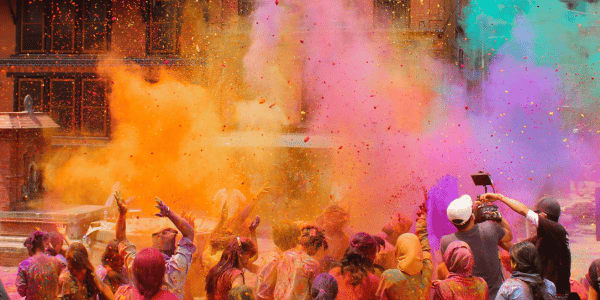 people throwing colors at Holi festival