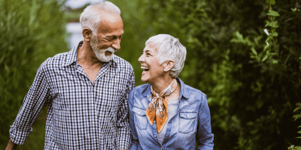 mature couple walking outside in spring