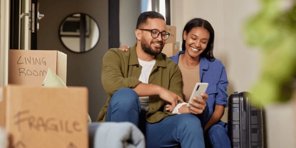 adult couple moving into new HOA home