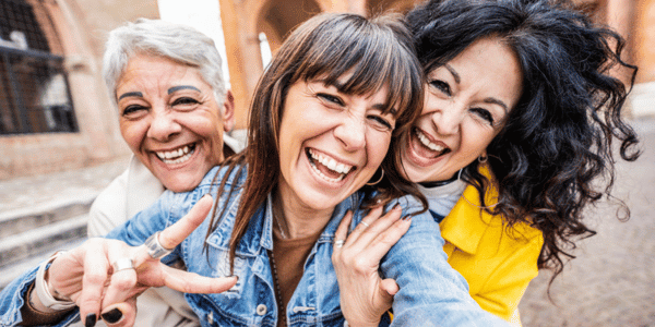 three Gen X women taking a selfie