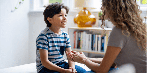 mother and young son talking