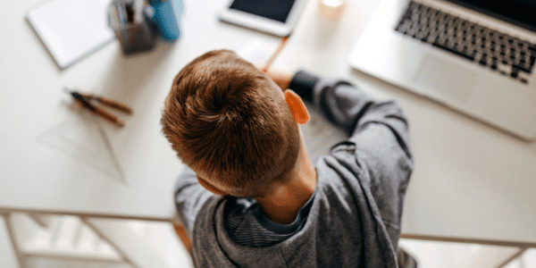 child doing homework alone