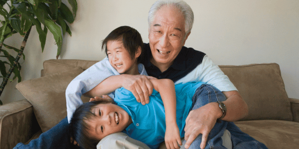 happy grandfather with two grandchildren