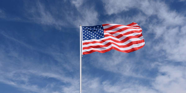 American flag on pole flying in the wind