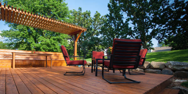 outdoor deck with patio chairs and table
