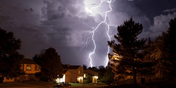 lighting strike over neighborhood homes