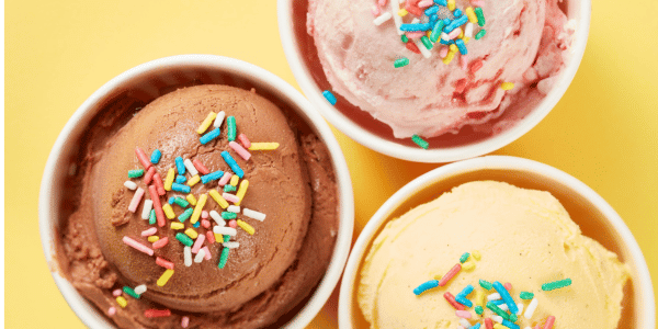three cups of ice cream with sprinkles