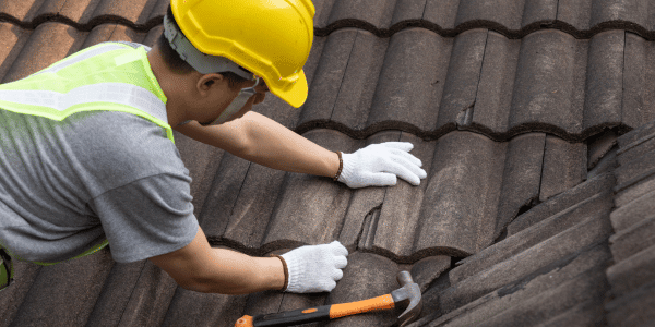 person inspecting roof
