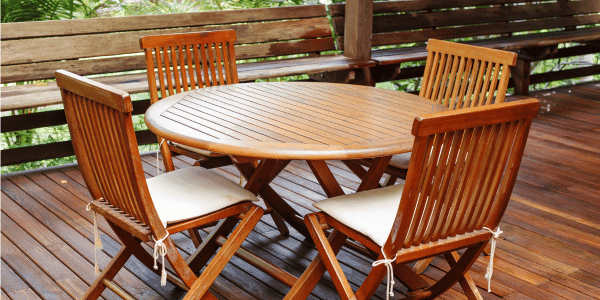 wooden round outdoor table and chairs.