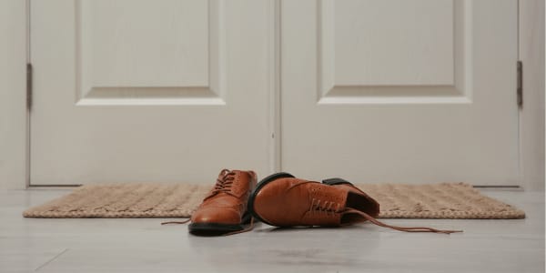 brown men's shoes left at front door