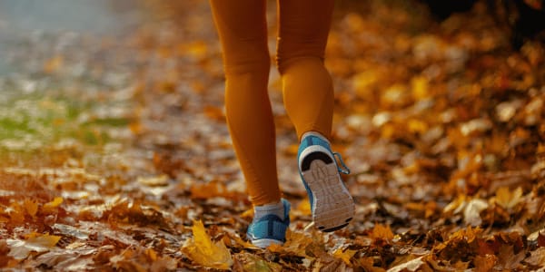 woman running outside during fall