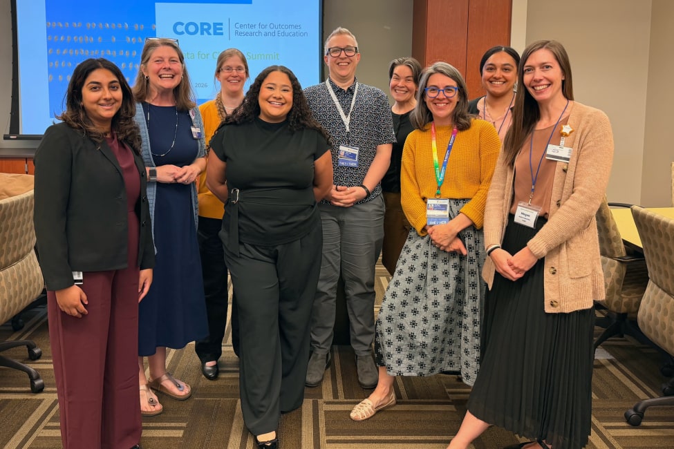 Seven CORE staff members and experts pose standing together at the 2026 Data Summit
