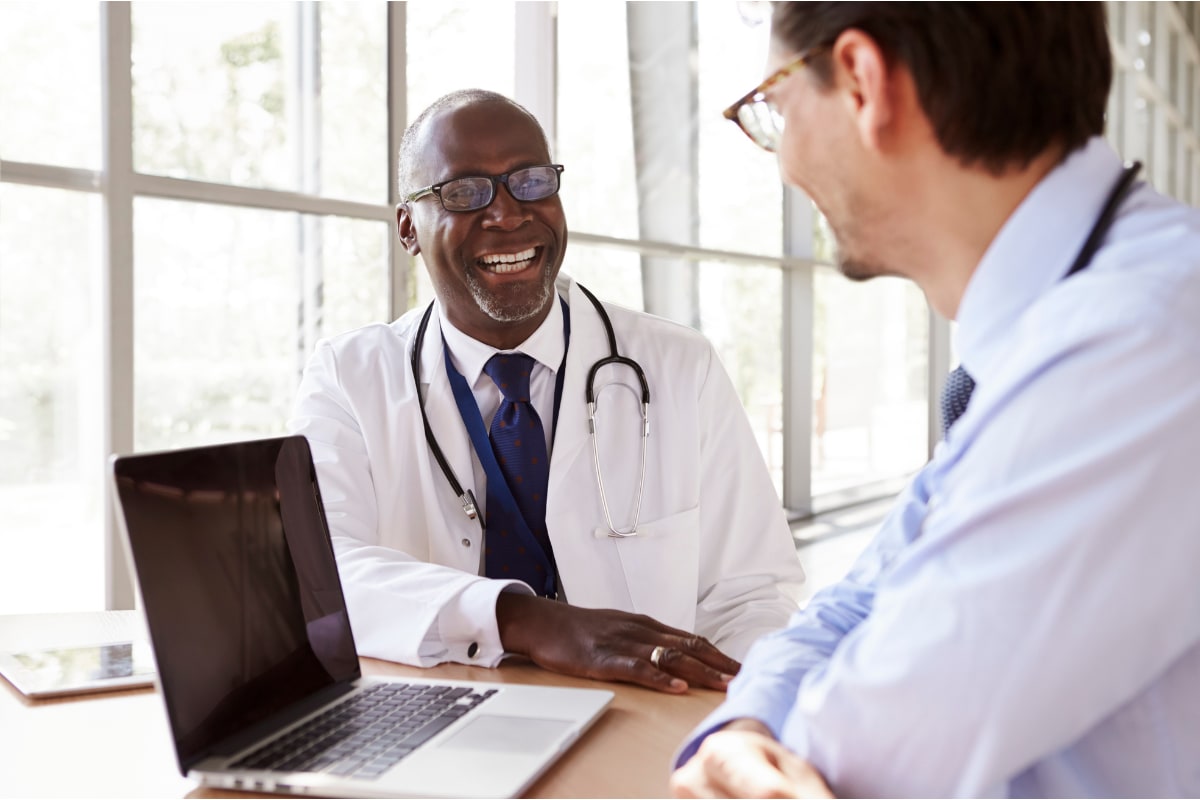 A healthcare provider consults with a patient