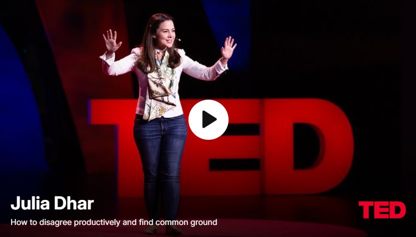 Julia Dhar on stage at a TED Talk.