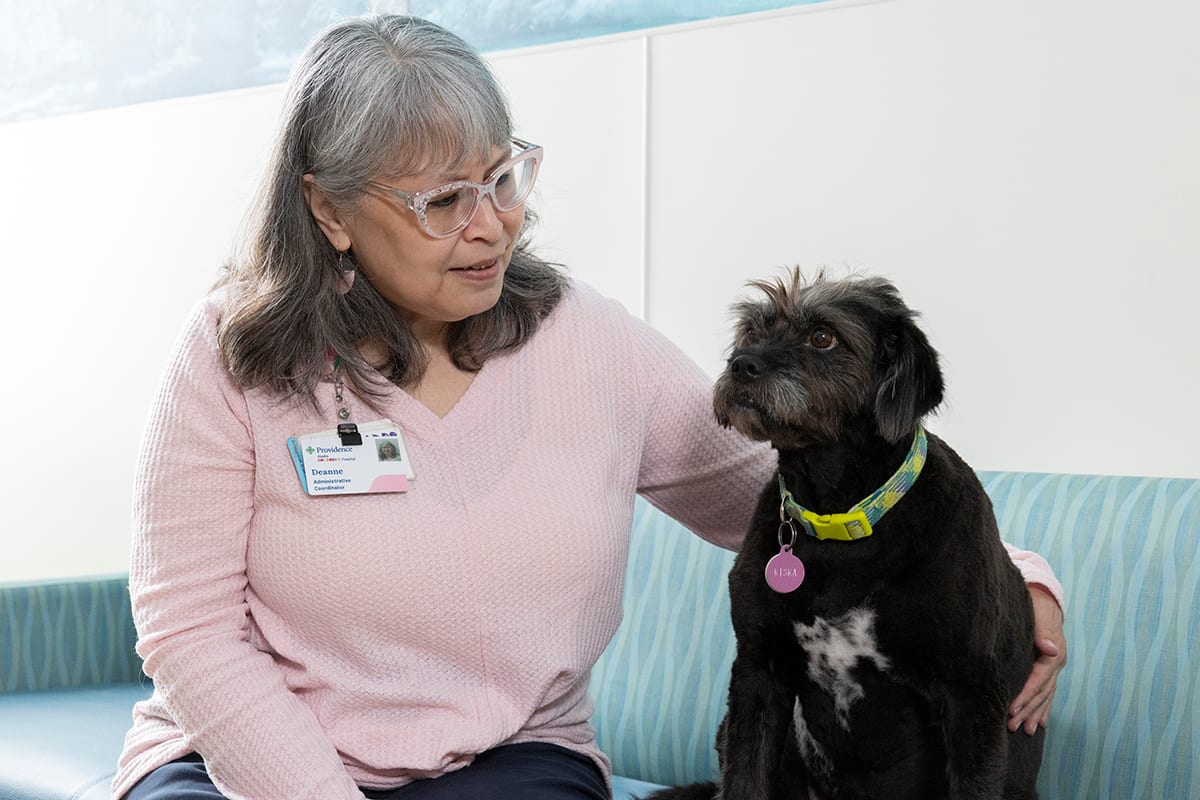 Deanne Antioquia, administrative coordinator at Alaska CARES, with therapy/facility dog Kiska Marie. Antioquia has been part of the Alaska CARES team since they opened their doors in 1996. Deanne Antioquia, administrative coordinator at Alaska CARES, with therapy/facility dog Kiska Marie. Antioquia has been part of the Alaska CARES team since they opened their doors in 1996.