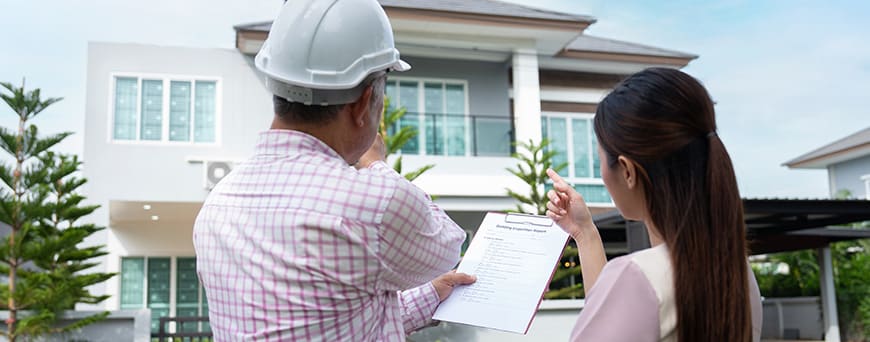 Contractor and woman discuss finished project.