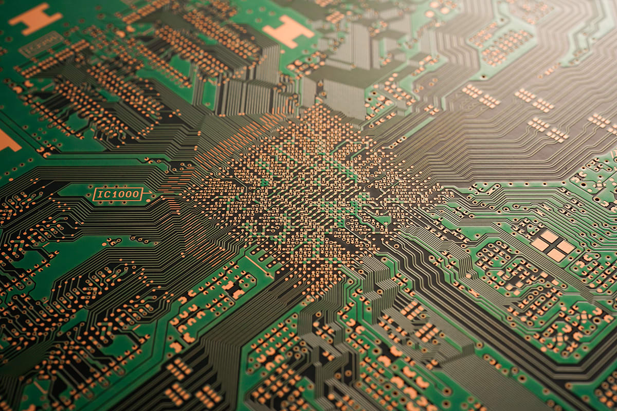 PCB closeup of fanout from a high-speed chip with RF transition vias coming off