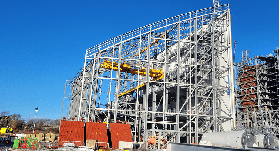 A photograph showing the curved steel structure of Skelton Grange, a half moon curve. 