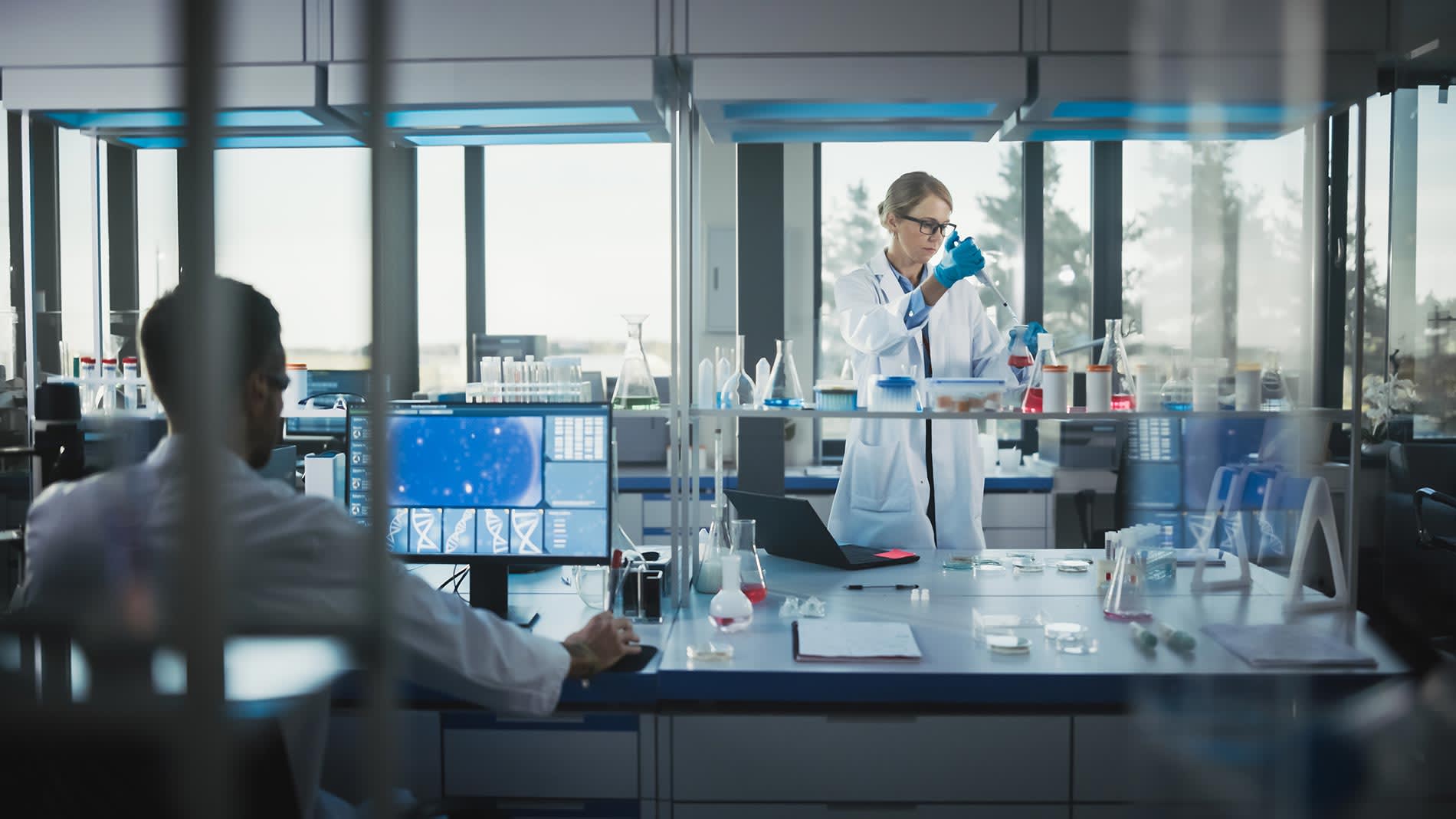 CFO checking out new automation dashboard on his computer at biotech startup